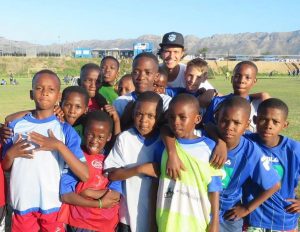 Young Bafana intern on the YB Soccer fields with the players