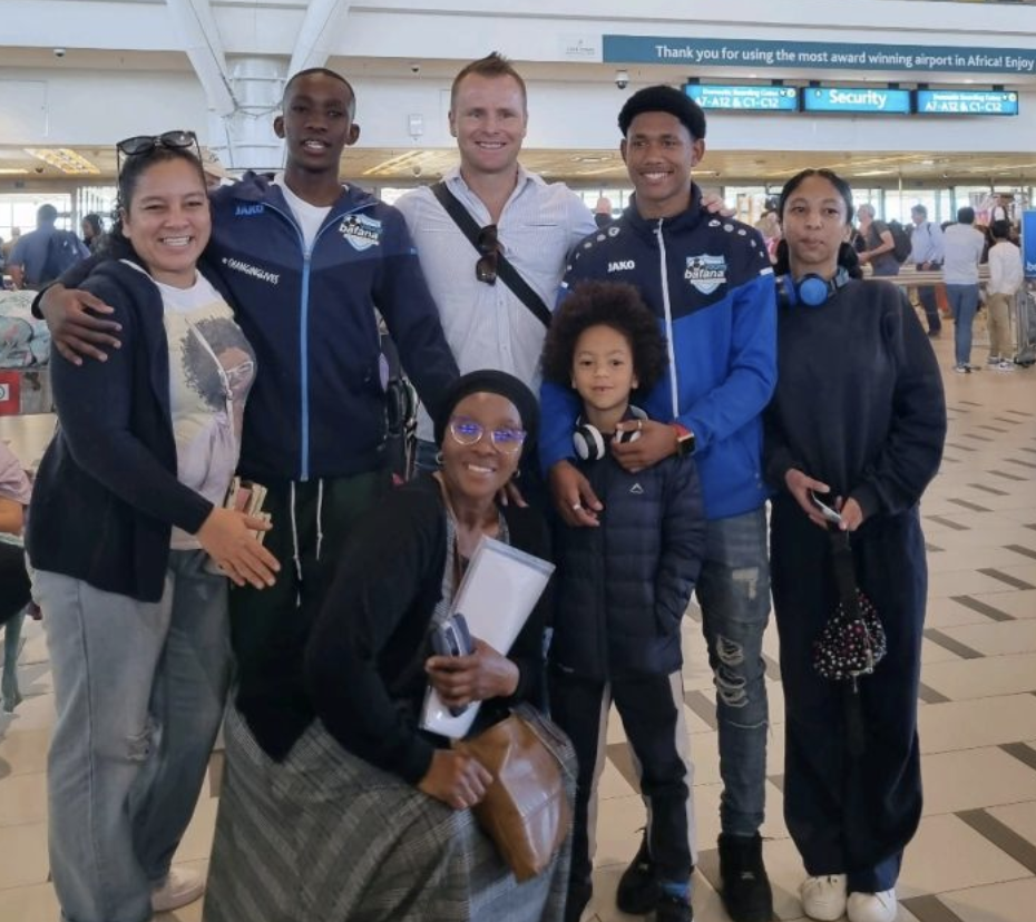 Liqhawe and Donay, together Bernd and their families at the airport before departing for France