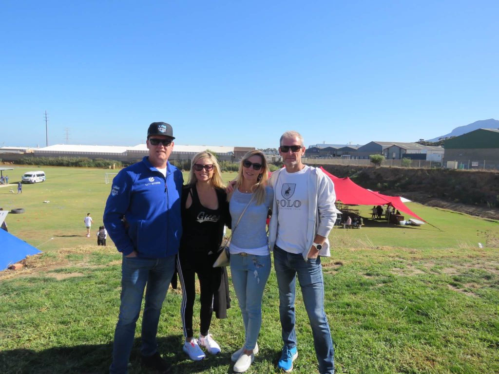 Group photo of four visitors of the YB Arena opening in South Africa.